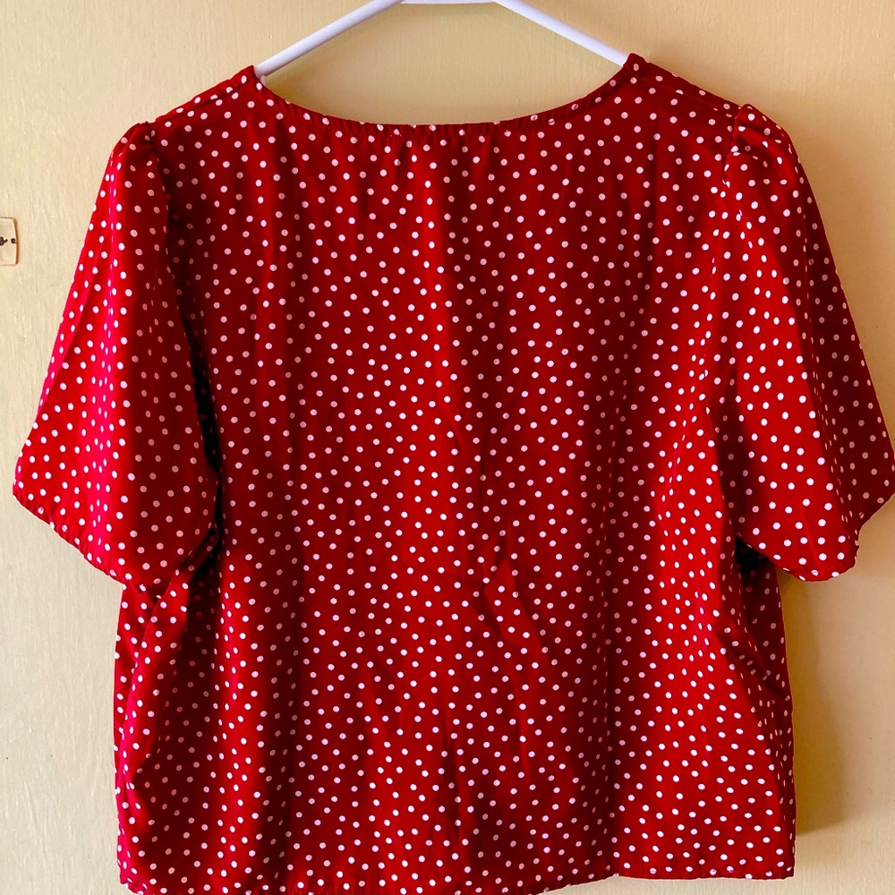 Red button-up blouse with white polka dots